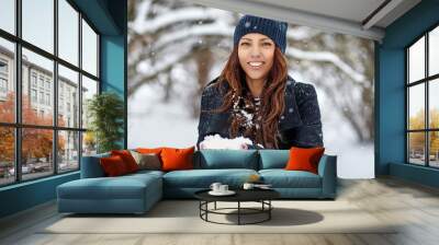 Beautiful smiling woman outdoor winter portrait Wall mural