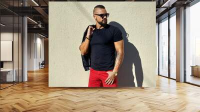 Confident handsome man in sunglasses. Outdoor fashion portrait Wall mural