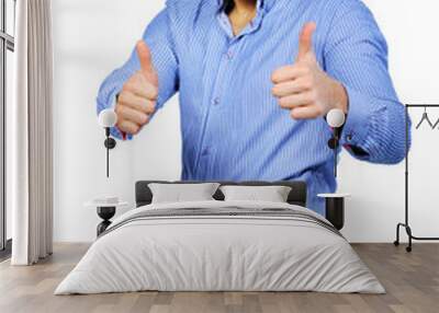 Happy casual young man showing thumb up and smiling isolated on Wall mural