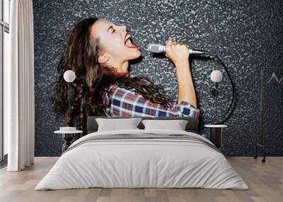 Woman singing with microphone Wall mural