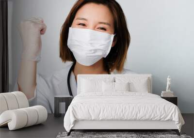 asian doctor wear the medical mask to protect and fight infection from germ, bacteria, covid19, corona , sars , influenza virus on white background. Wall mural