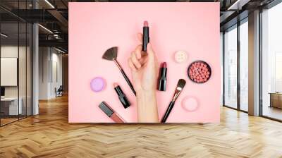 Makeup cosmetic with beauty bag on  pink background. lipstick, brush, eye shadow and accessories. woman fashion. Wall mural