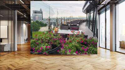 Sky cafe on the roof terrace with view of modern city Wall mural