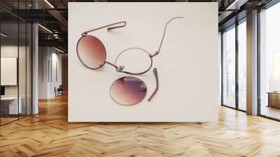 Broken sunglasses with round lenses Wall mural