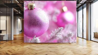 Christmas tree branch with pink bauble is reflecting on a wet surface with a bokeh effect on gradient pink background. Christmas background or New Year's backdrop, holiday banner with copy space Wall mural