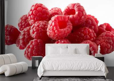 A cluster of ripe raspberries stacked on a clean, white surface. Wall mural