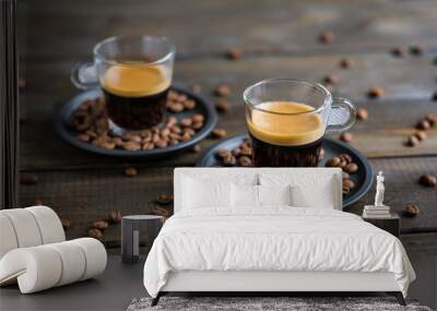 Two cups of espresso and coffee beans on a wooden table Wall mural