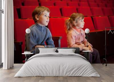 boy and  little girl sitting on armchairs at cinema Wall mural