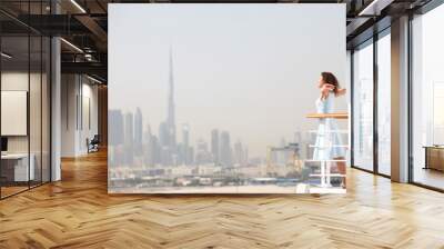 brunette woman standing on cruise liner deck Wall mural