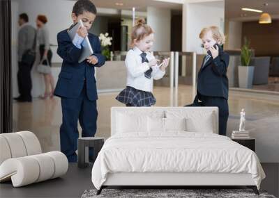 Children with communication devices in business clothing Wall mural