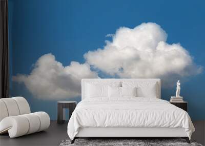 Fluffy white clouds in the blue sky Wall mural