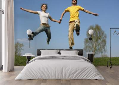 jumping couple. spring Wall mural