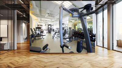 Modern gym with new shiny fitness equipment, big mirror for sport training Wall mural