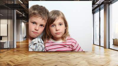 Portrait of thoughtful little girl and boy Wall mural