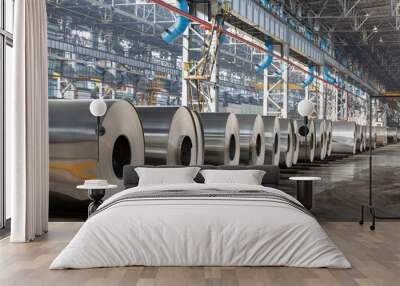 Row of rolls of aluminum lie in production shop of plant. Wall mural