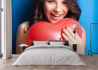 Love and valentines day woman holding heart smiling cute and ado Wall mural