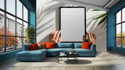 person holding tablet pc Wall mural