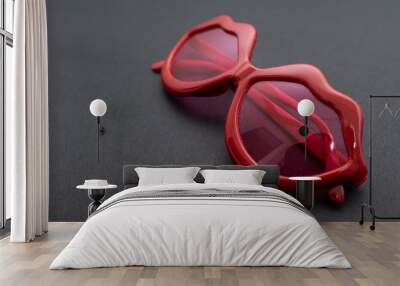 red plastic glasses on black background Wall mural