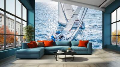 Sailing boats from bird view crossing open sea Wall mural