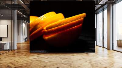 orange sliced on dark wooden background. with copy space. Wall mural