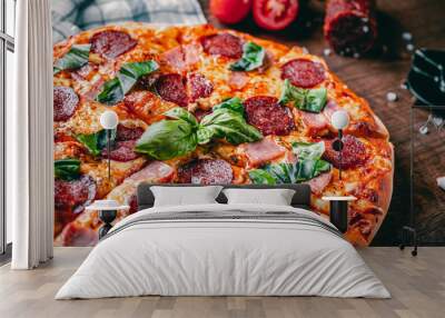 Pepperoni Pizza with Mozzarella cheese, salami, ham, Spices and Fresh basil. Italian pizza on wooden table background Wall mural