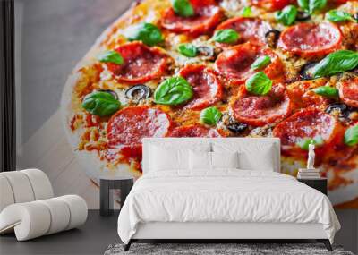 Pepperoni Pizza with Mozzarella cheese, salami, Tomatoes, olive, pepper, Spices and Fresh Basil. Italian pizza on wooden table background Wall mural