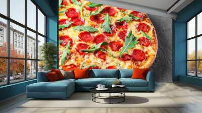 Pepperoni Pizza with Mozzarella cheese, salami, Tomatoes, pepper, Spices and Fresh arugula. Italian pizza on Dark grey black slate background Wall mural