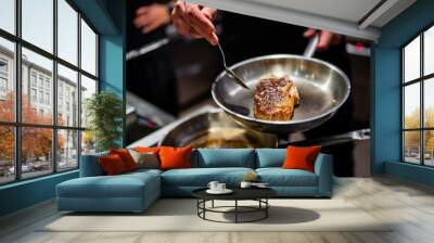 Professional chef cooking beef steak in frying pan on stove in restaurant kitchen Wall mural