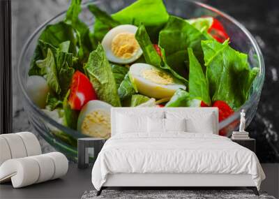 spinach salad with eggs, pepper and tomatoes in glass bowl on dark background Wall mural