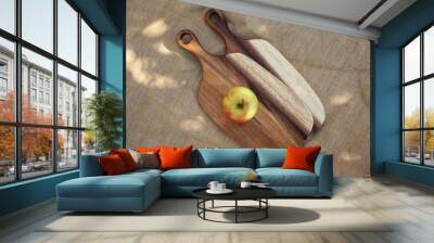 Two cutting boards with a yellow apple Wall mural