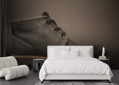 vintage black boots on black background, retro shoes Wall mural