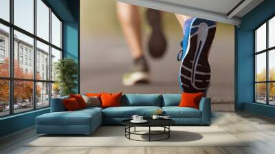 Runners feet running on road close up on shoe,  male triathlete runner Wall mural