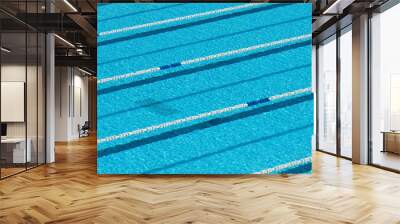 Swimming pool with blue water for sporting swimming with tracks, swim lanes in olympic swimming pool Wall mural