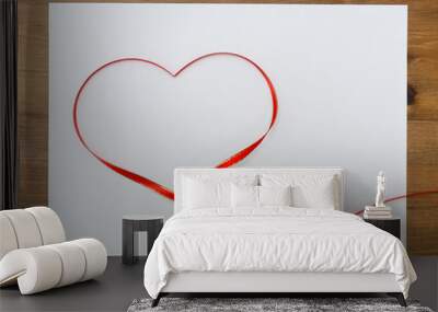 Photo frame with valentines heart shaped ribbon over wooden tabl Wall mural