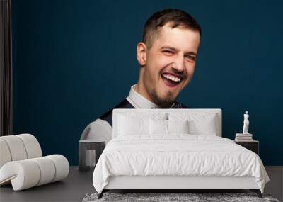 Portrait of a joyful young man in formal clothes Wall mural