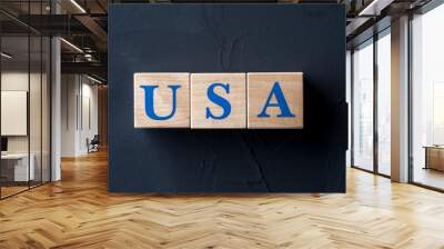 Wooden cubes with word USA on dark table. Wall mural