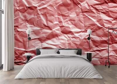 Crumpled sheet of paper in red color. Wall mural