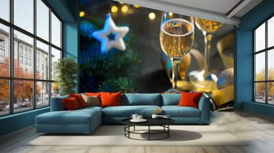 Two glasses of champagne on a decorated Christmas table Wall mural