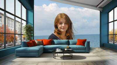 young girl on sea background Wall mural