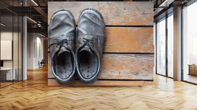 the old genuine leather shoes on a wooden background Wall mural