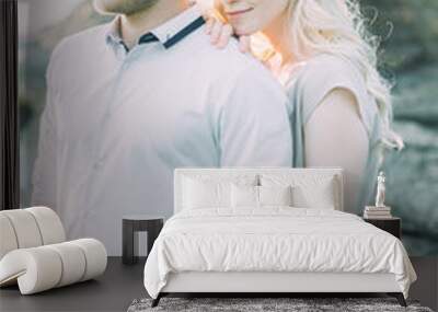 Wedding couple on a walk, photo shoot in the mountains. Fine art style in the decor. A stylish young model Wall mural