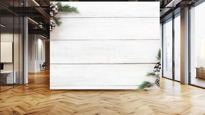 Christmas background. Christmas frame made of fir leaves and pine cones decoration rustic elements on white wood board. Creative flat lay, top view design Wall mural