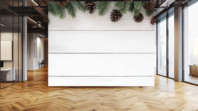 Christmas frame made of fir tree branch and pine cones decoration rustic elements on white wooden. Creative flat lay, top view design Wall mural