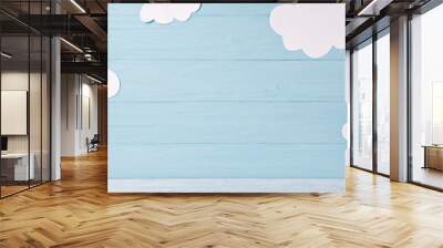 Cute children or baby background, white clouds on the blue wooden background Wall mural