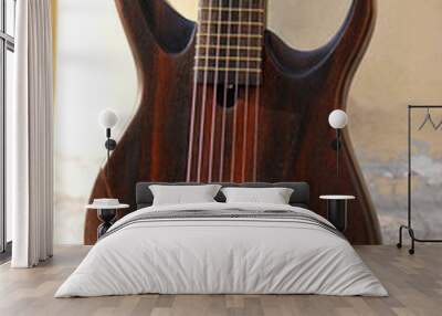 Seven-string electric guitar made of dark wood. Background for music and creativity. Wall mural