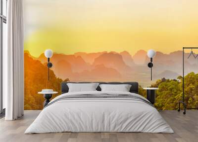 Beautiful panorama landscape with dramatic sunset, tropical rainforest and steep mountain ridge on horizon. Krabi, Thailand Wall mural