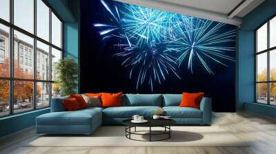 Blue fireworks on night black sky background Wall mural