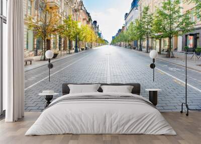 City street with empty road and morning light in Europe, Lithuania, Vilnius Wall mural