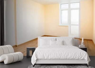 Living room interior of empty room with wooden floor and light from the big window Wall mural