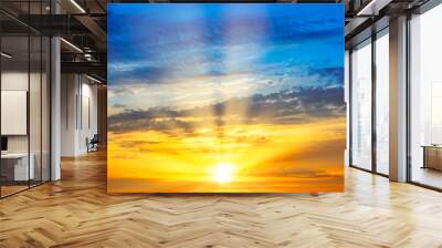 Sunset sky with sunset clouds, sun rays and dramatic sky Wall mural